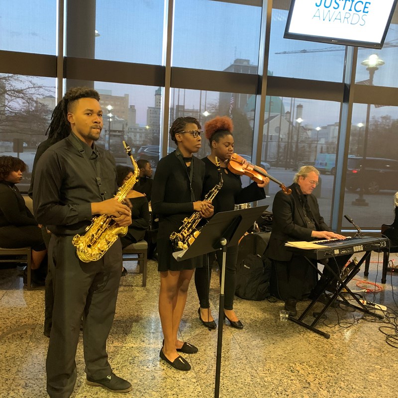 band with saxophone, clarinet, violin, and keyboard player