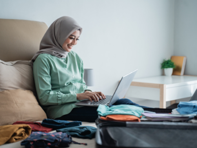 woman entering information into computer
