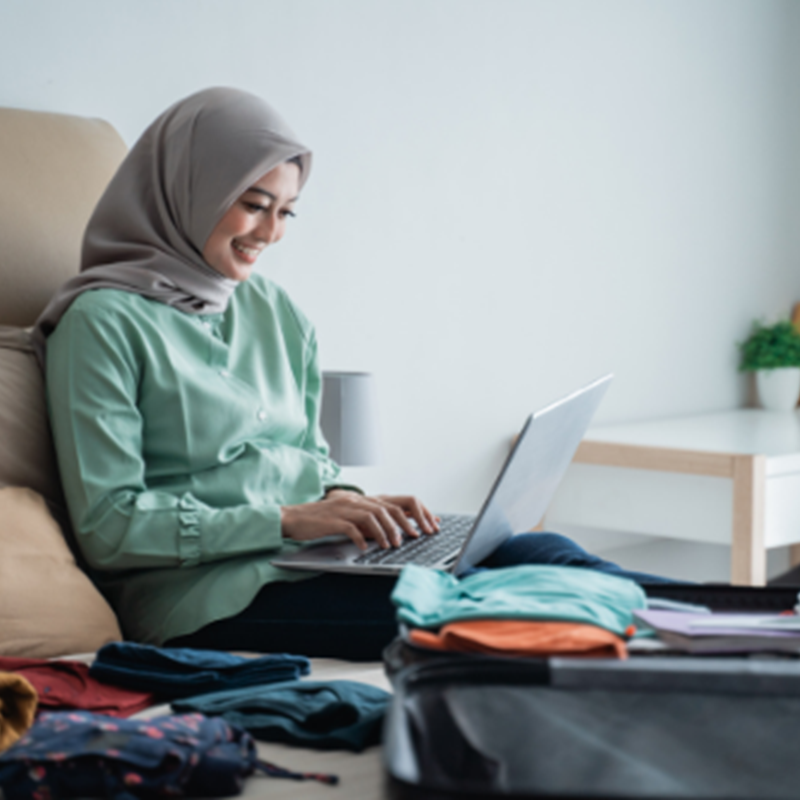 woman entering information into computer