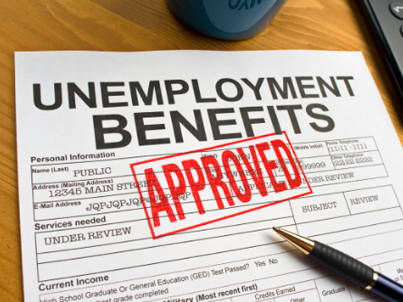 Unemployment Benefits application with red "APPROVED" stamp