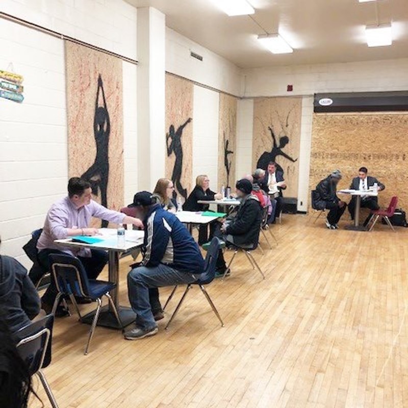 attorneys and clients sitting at tables